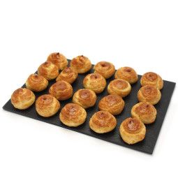 Gougères with cheese on a platter