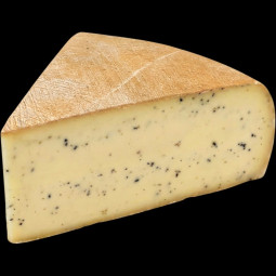 Raclette au lait cru à la truffe d'été 1,3% ±750g FROMAGERIE MONNIN - 1